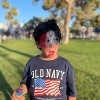 Young boy with America face paint. 