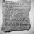Auto-generated description: A torn piece of paper with a typewritten poem about nature, life, and the cycles of animals like a rabbit, salmon, and bear is displayed on a marble surface.