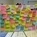 Photo of 'graffiti board' covered in multi-coloured post-it notes with comments from residents