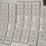 A close-up view of a white computer keyboard with WASD keys showing.