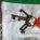 Old keys on a ring are placed on a folded Palestine flag, with red, green, white, and black colors.