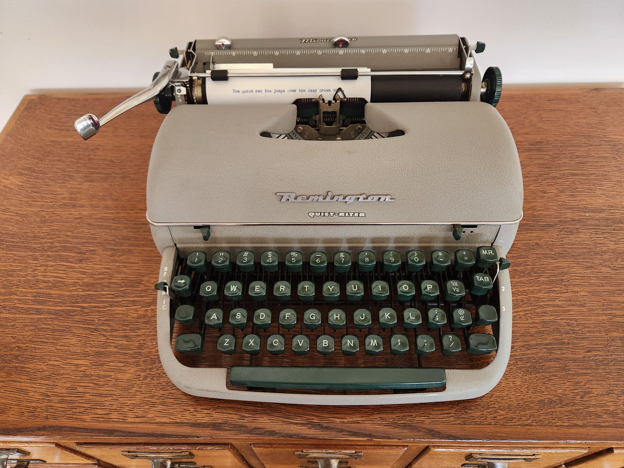 Front view of the Remington Quiet-Riter sitting on a library card catalog