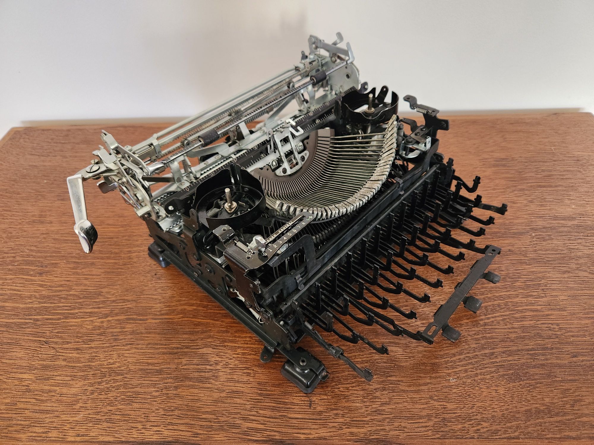 Close up of a naked 1952 Royal Quiet De Luxe typewriter seen from an oblique view.