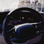 Steering wheel and digital driver display inside a Lucid Air electric car