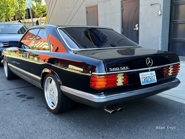 A black Mercedes 500 SEC