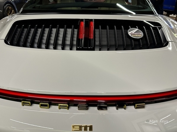 Gold badging on the back of a bespoke Porsche 911