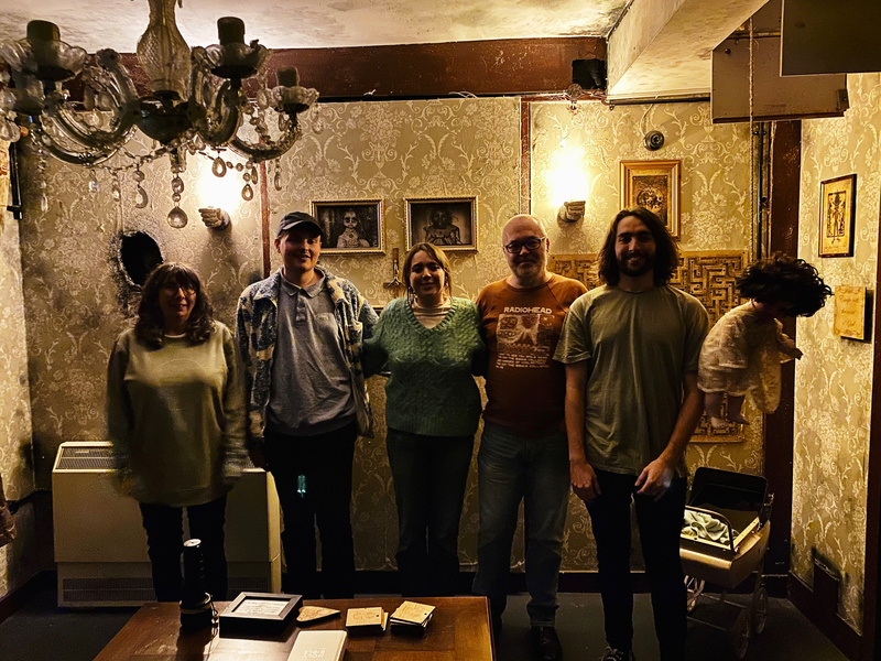 Group of five people in a spooky room