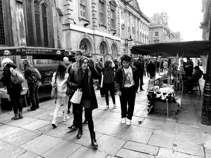 Black and white view of stalls in a street market