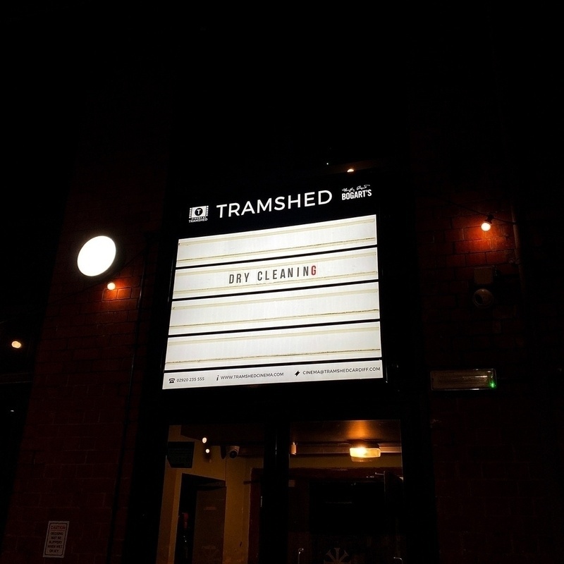 Illuminated sign advertising Dry Cleaning gig