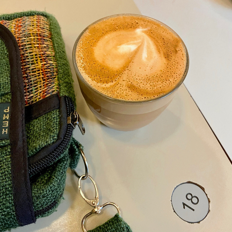 Frothy coffee in a glass