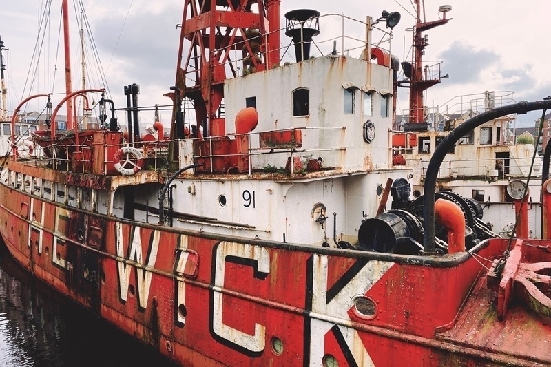 Close up detail of rusting orange and white ship