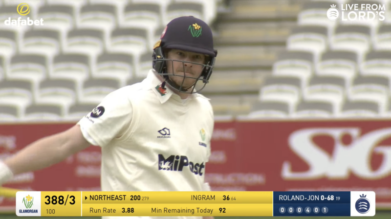 Close up of cricket player with game scoreboard graphic below showing 200 runs scored